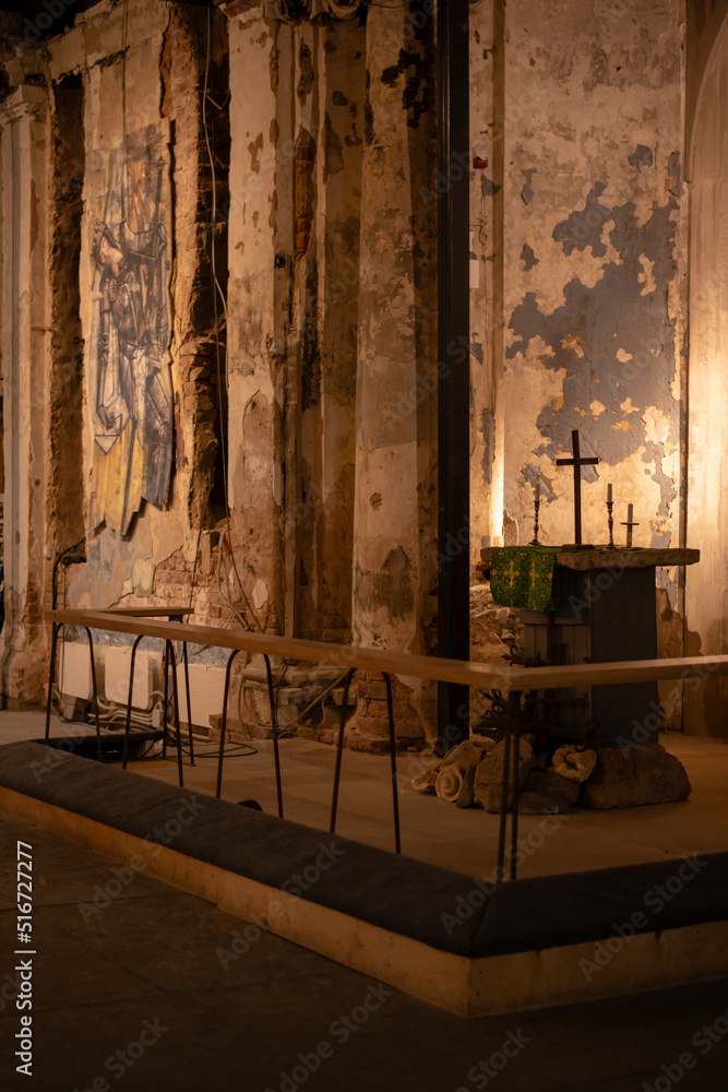 Dark old historic building interior. Old historical destroyed peeling walls of the St. Anne Church in St. Petersburg. Dark old historic building interior. Old historical destroyed peeling walls of the St. Anne Church in St. Petersburg.