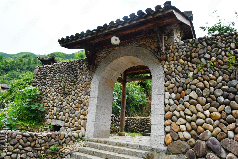 traditional Chinese style door on stone wall, China, Zhejiang Province traditional Chinese style door on stone wall, China, Zhejiang Province