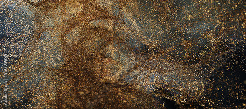 Gold sparkle glitter explosion dust particles background with bokeh, gold holiday happy new year and valentine day concept