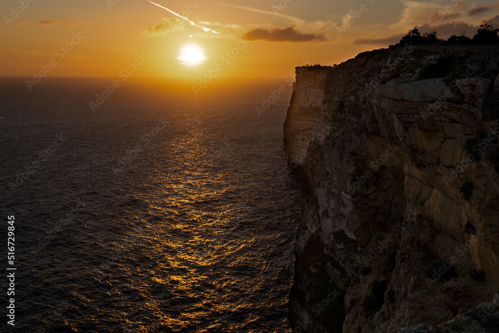 Photograph of a sunset over the sea from the cliffs