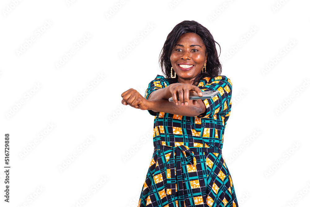 happy adult woman holding mobile phone smiling. happy adult woman holding mobile phone smiling.