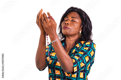 woman praying with a rosary.