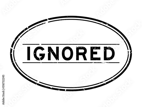Grunge black ignored word oval rubber seal stamp on white background