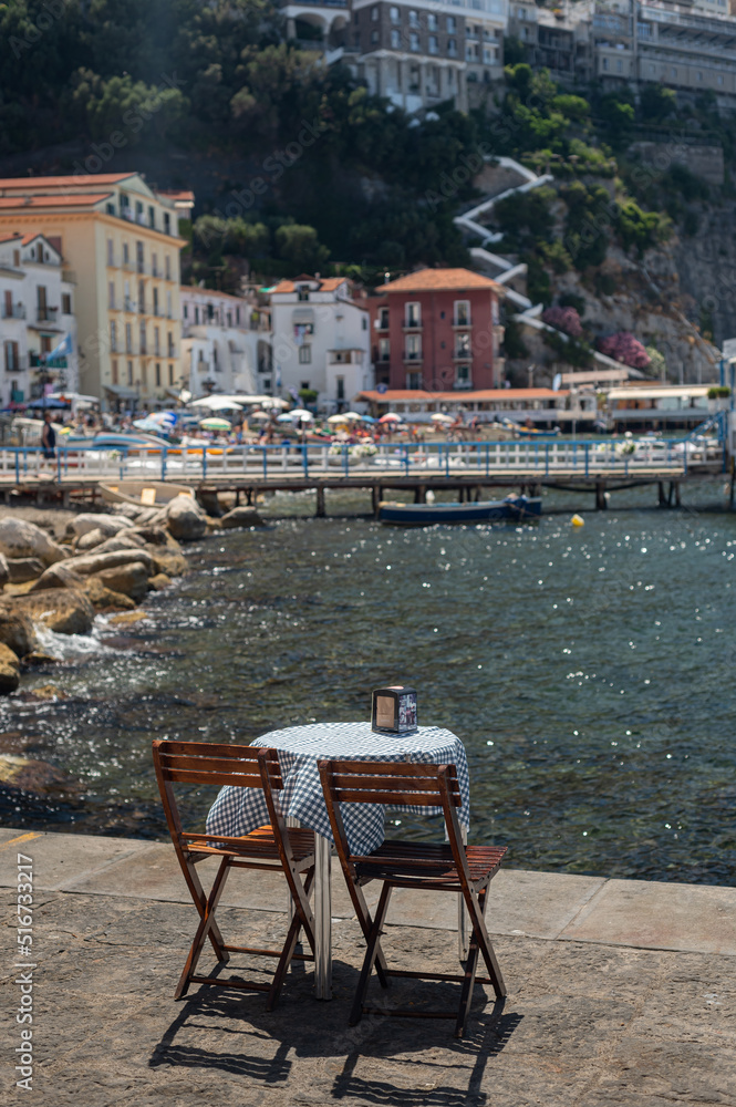 Coffee table and chairs in a cozy place. Coffee break in Italy, in Sorrento. Rest by the sea.