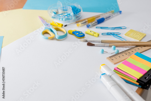 Back to school. Set for school activities. Stationery. Beautiful, creative selection of scissors, pencils, felt-tip pens. Colored background. Yellow-blue set. Measured active life. sustainable.