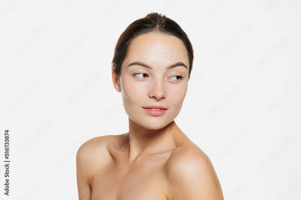 Portrait of beautiful tender woman with smooth clear skin isolated over white studio background. Cosmetics Portrait of beautiful tender woman with smooth clear skin isolated over white studio background. Cosmetics