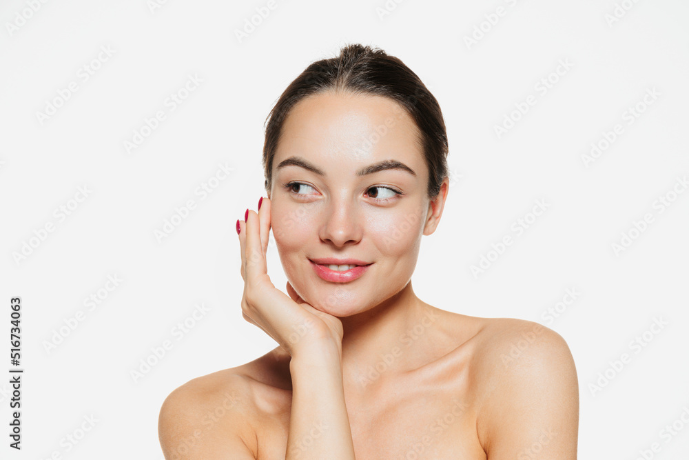 Portrait of beautiful tender woman with smooth clear skin isolated over white studio background Portrait of beautiful tender woman with smooth clear skin isolated over white studio background