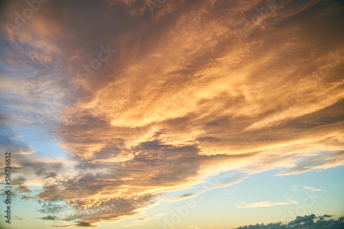 Colorful sky during sunset. Clouds are illuminated by sunlight. High quality photo