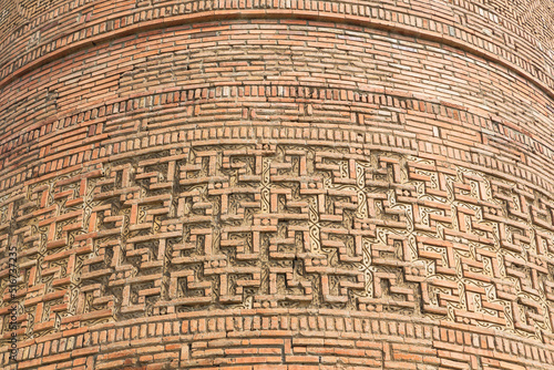 Decorative elements of a brick wall of Uzgen Minaret, Uzgen town, Osh Region, Kyrgyzstan photo