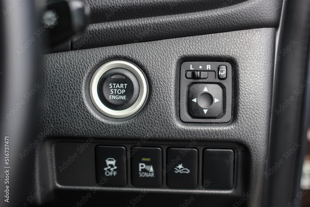 Close up engine car start button. Start stop engine modern new car button,Makes it easy to turn your auto mobile on and off. a key fob unique ,selective focus Close up engine car start button. Start stop engine modern new car button,Makes it easy to turn your auto mobile on and off. a key fob unique ,selective focus