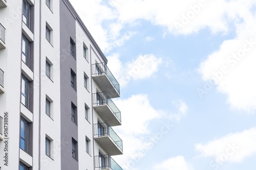 Modern apartment building facade on sky background