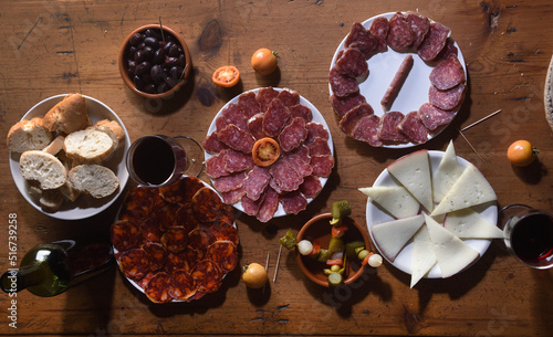 high angle view of plate of tapas on wooden table photo