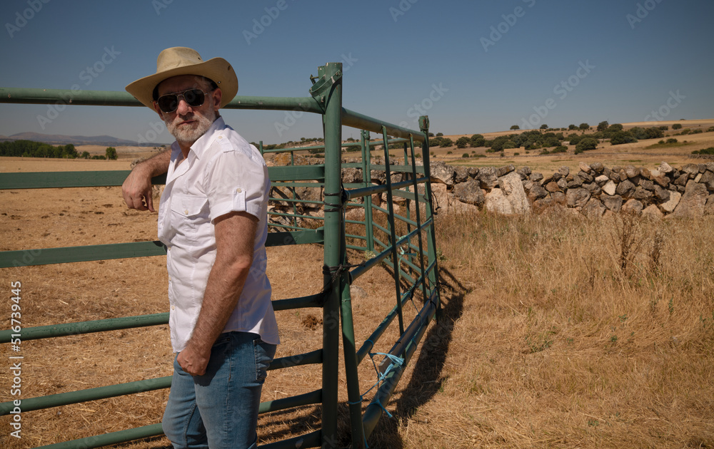 Adult man in cowboy hat in fields. Castilla y Leon, Spain