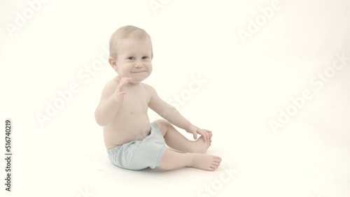 baby child sitting on the floor