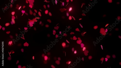 Falling red hearts confetti on black background, loopable 3D animation in 4K UHD with shallow depth of field