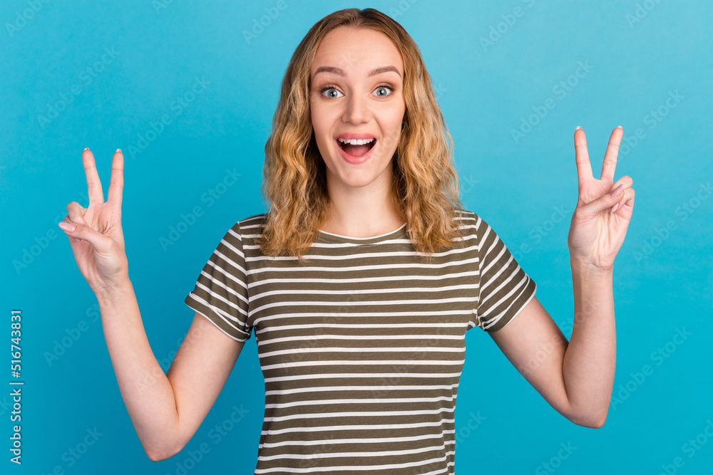 Portrait of nice cute young lady screaming making v sign wear casual outfit isolated blue color background Portrait of nice cute young lady screaming making v sign wear casual outfit isolated blue color background