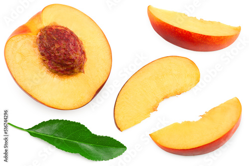 sliced peach fruit with green leaf isolated on white background. clipping path. top view