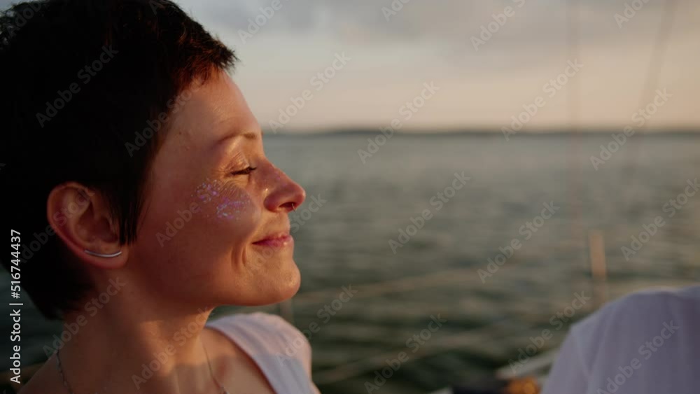 A young couple kisses while walking on a yacht A young couple kisses while walking on a yacht
