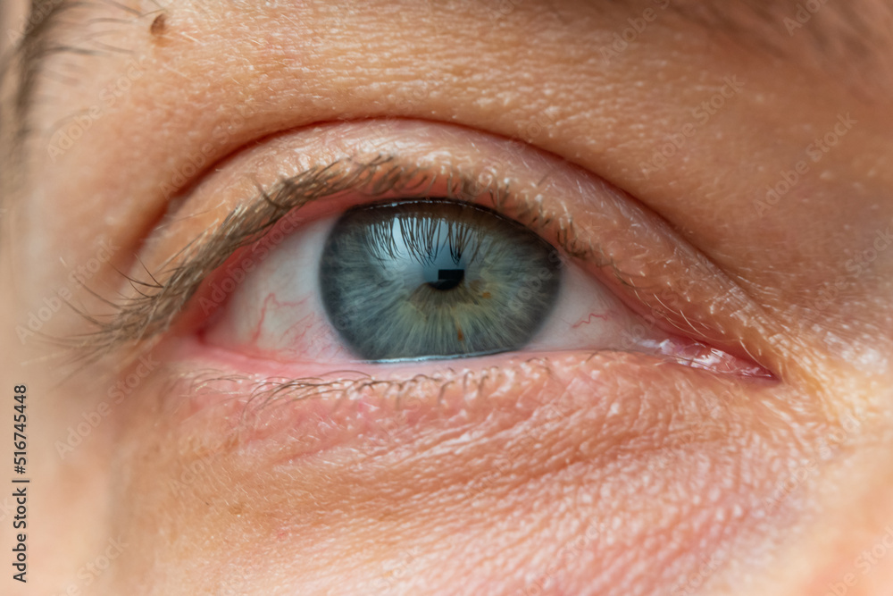 Obraz premium Wide open Caucasian male eye. Close up shot portrait, unrecognizable face