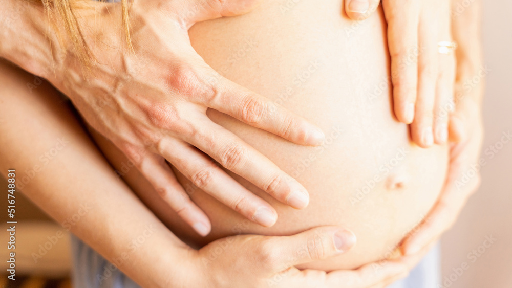 Naklejka premium Pregnant couple belly hands. Happy pregnancy woman and husband hugging pregnant belly. Concept of pregnancy, maternity, expectation for baby birth.