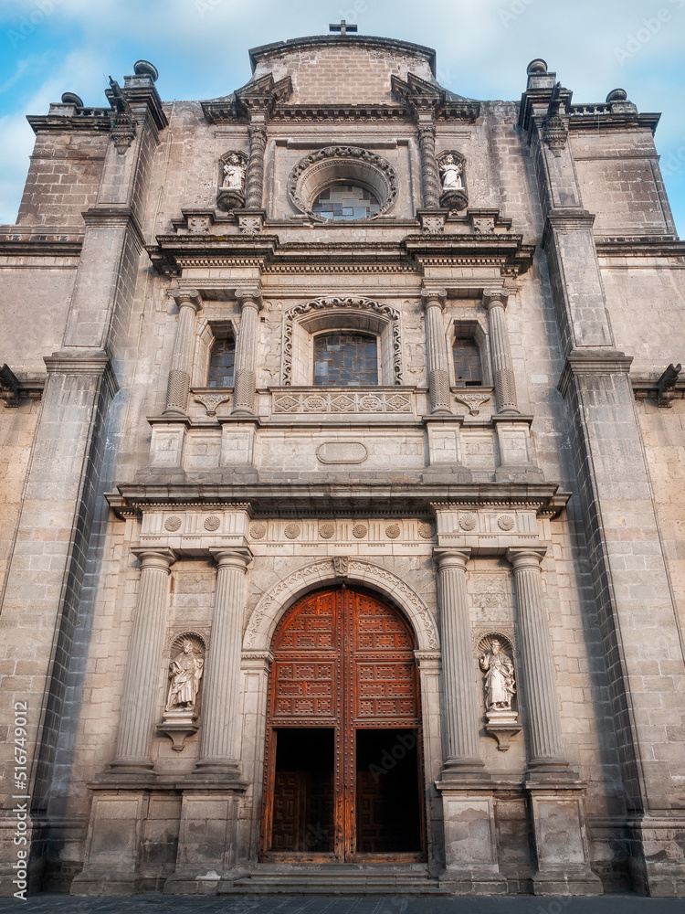 Western entrance and facade detail at Metropolitan Cathedral in Zocalo, Center of Mexico City, Mexico. This grand Roman Catholic cathedral with many ornate chapels is Latin America's oldest and larges