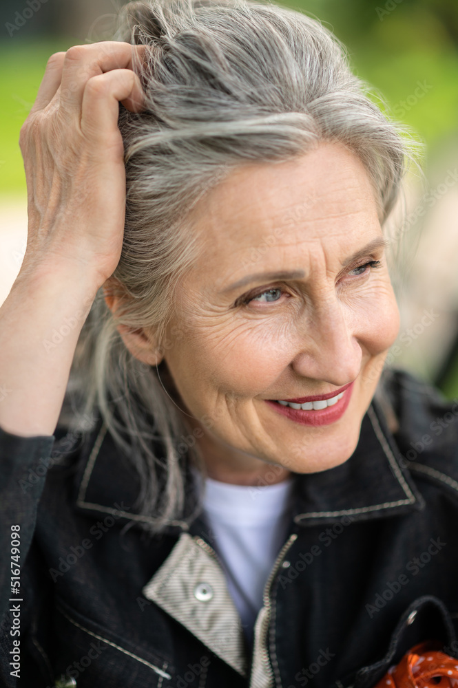 Portrait of a mature woman smiling and looking aside Portrait of a mature woman smiling and looking aside