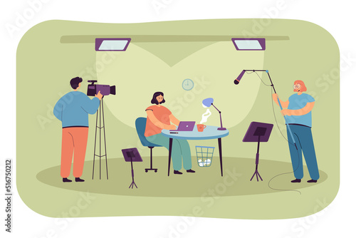 People filming TV show in studio flat vector illustration. Broadcaster sitting at table and looking at laptop screen. Media, television concept for banner, website design or landing web page
