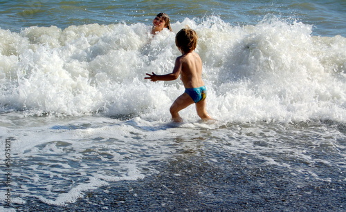 children running on the beach