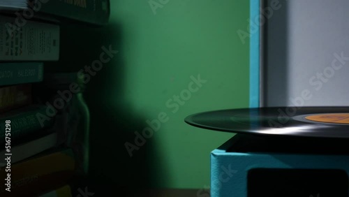 Side view of a vinyl record playing.