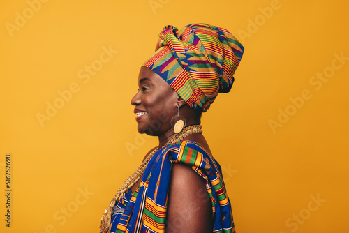 Принти на полотні Happy African woman wearing cultural clothing in a studio