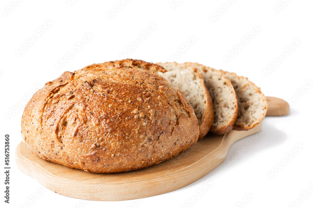 Multigrain bread lies on a wooden board