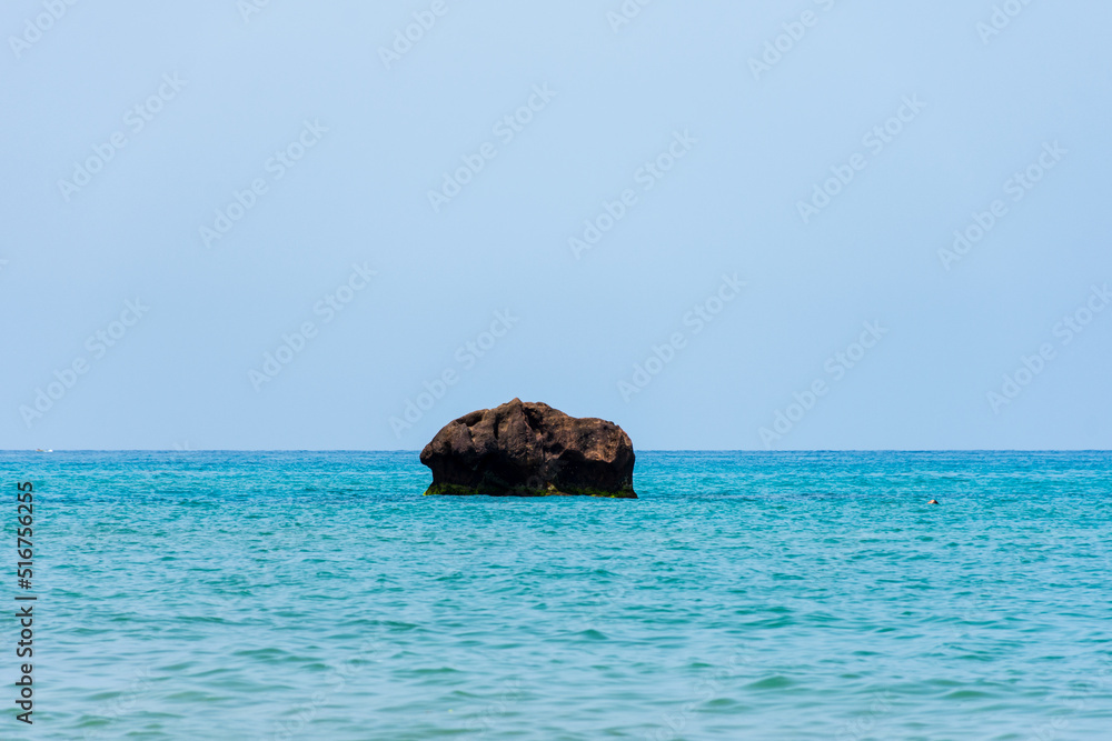 Rock in the middle of the Mediterranean sea.