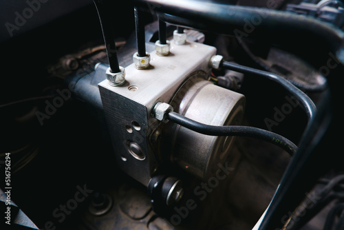 ABS unit module control box with pipes of a car brake system photo