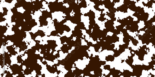 Brown cowhide with white spots as a seamless pattern. Spotted vector background. Animal print. Panda, dalmatian or appaloosa horse skin texture. photo