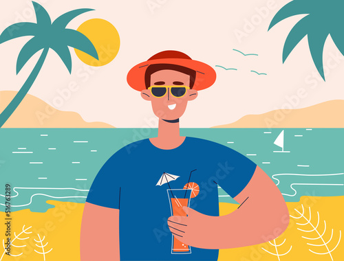 Man on summer vacation concept. Happy boy  holds cocktail in her hand. He is wearing sunglasses. Concept for outdoor activities and summer travel topics.