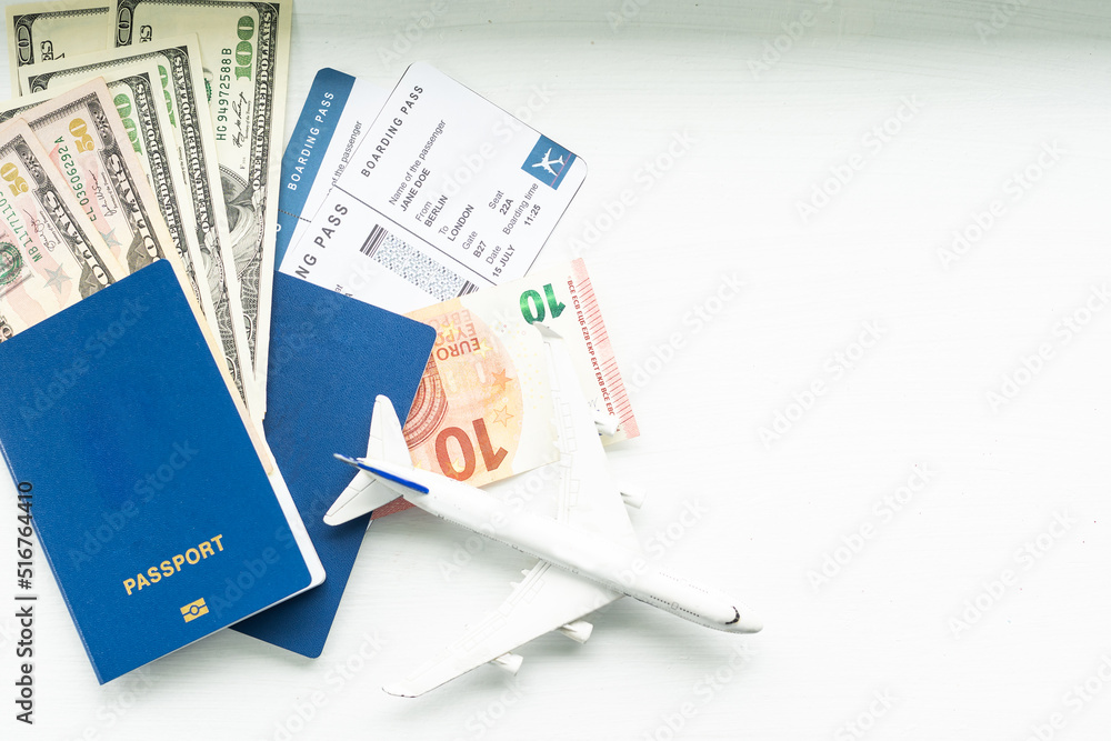 Preparation for Traveling concept, toy airplane, passport with copy space Preparation for Traveling concept, toy airplane, passport with copy space