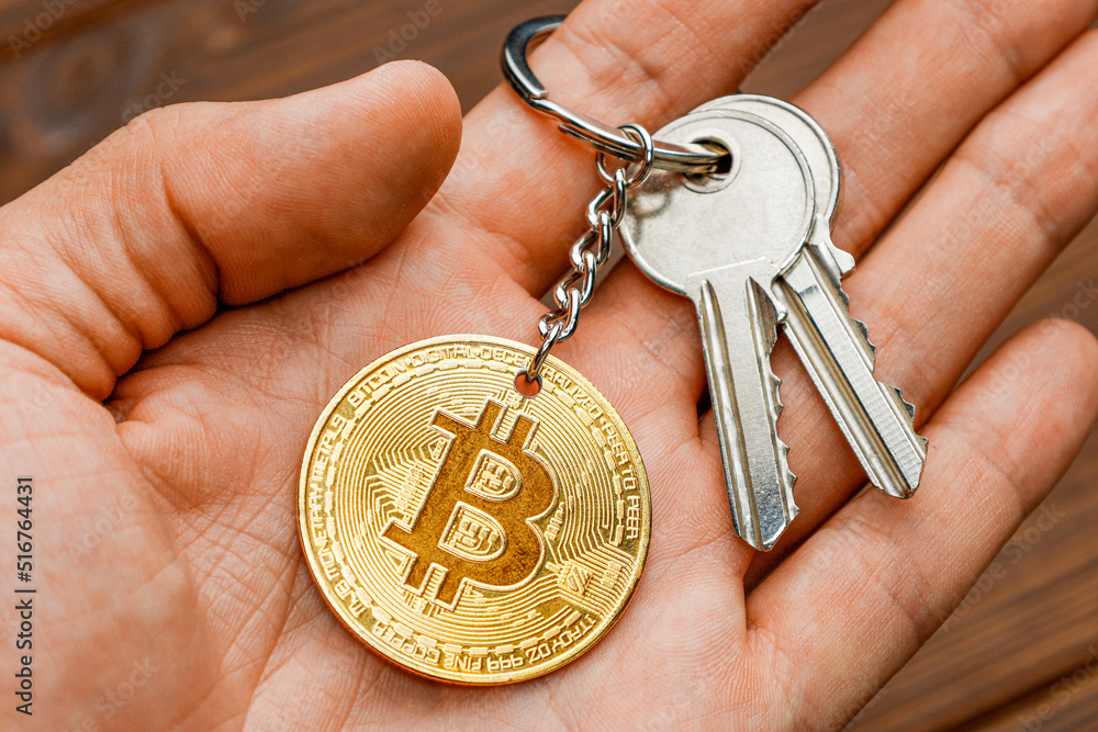 Bitcoin keys in human hand. Cryptocurrency password Bitcoin keys in human hand. Cryptocurrency password