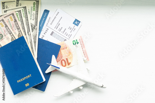 Preparation for Traveling concept, toy airplane, passport with copy space