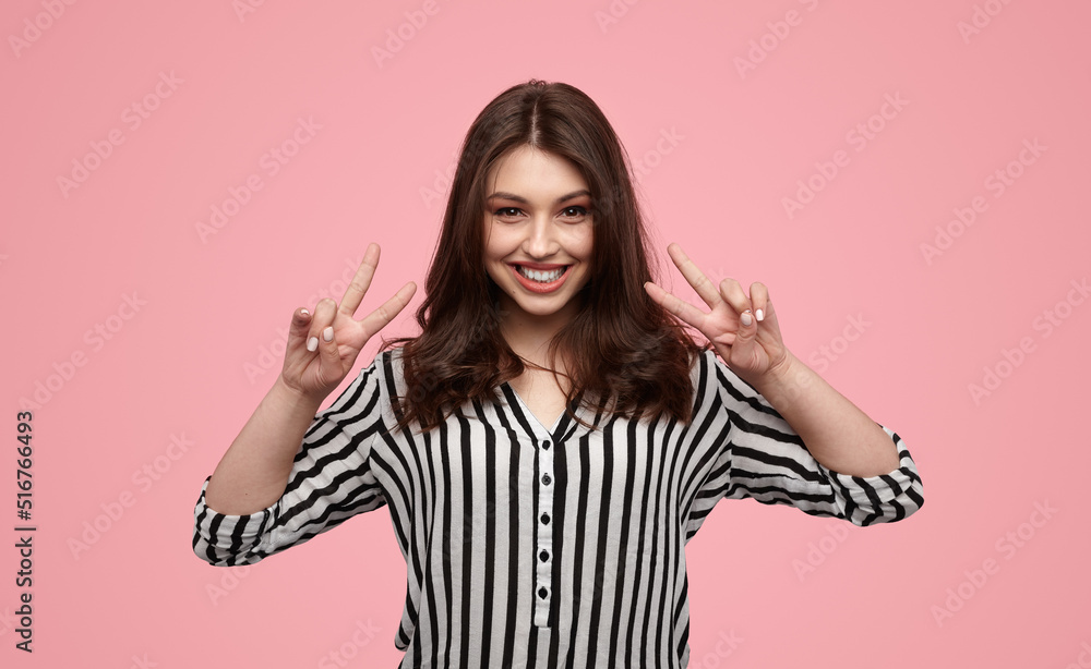 Merry female gesturing V sign Merry female gesturing V sign