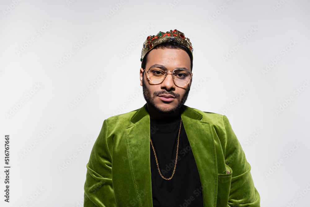 eastern hip hop performer in green velvet blazer and crown isolated on ...