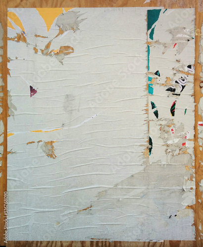 Fotografija Ripped poster paper texture on chip board
