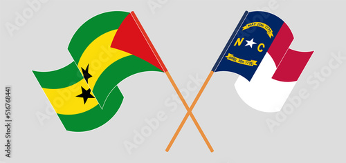 Crossed and waving flags of Sao Tome and Principe and The State of North Carolina