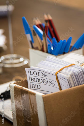 Bidder cards and pencils at an auction photo