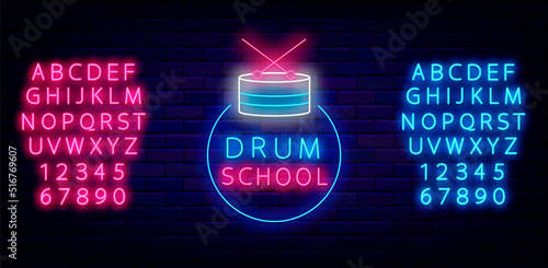 Drum school neon label on brick wall. Drum kit in circle frame. Shiny blue and pink alphabet. Vector illustration