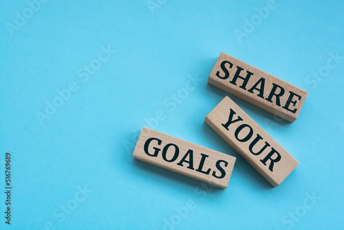 Wooden blocks with words 'Share your goals'.
