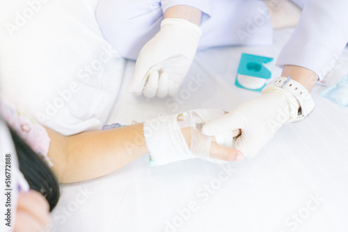 Hand nurses with saline intravenous at hospital 