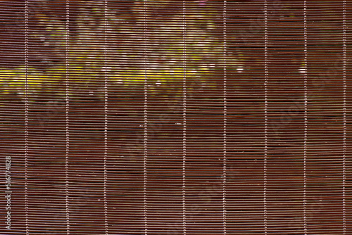 Cortina de bamboo, intimidad en espacio, se intuye fondo ajardinado photo