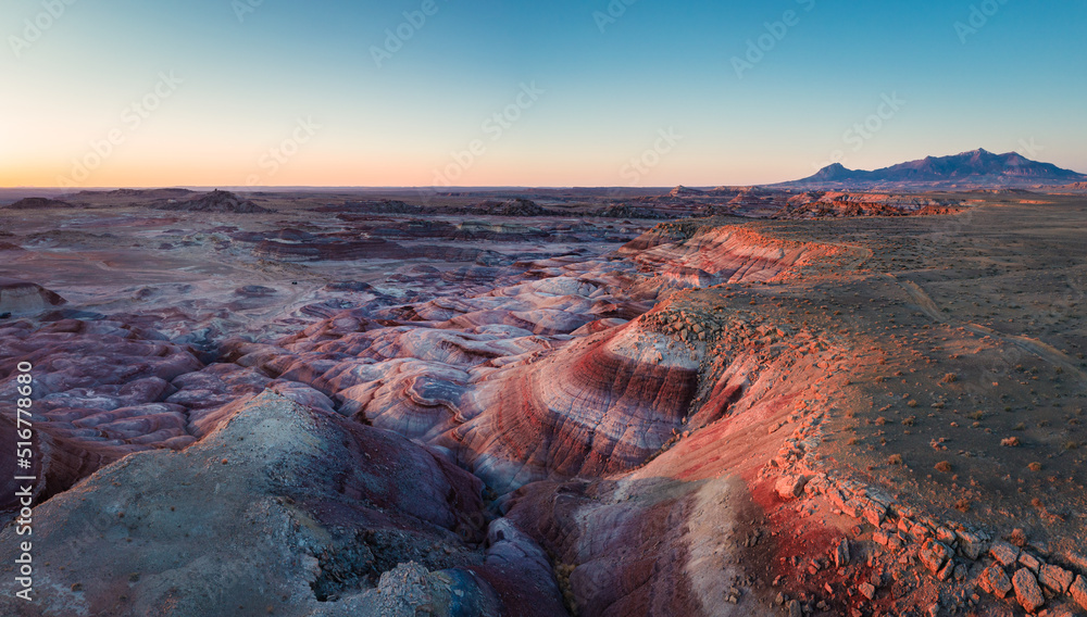 Moonscape landscape in Utah. Red rocks glow at sunrise