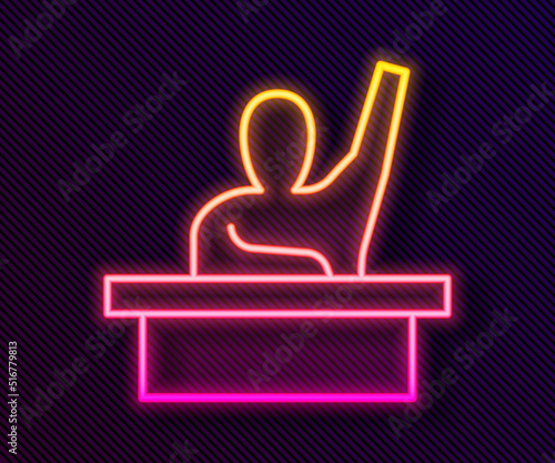 Glowing neon line Active male kid raising hand answering to teacher question icon isolated on black background. An elementary student raises his hand. Vector