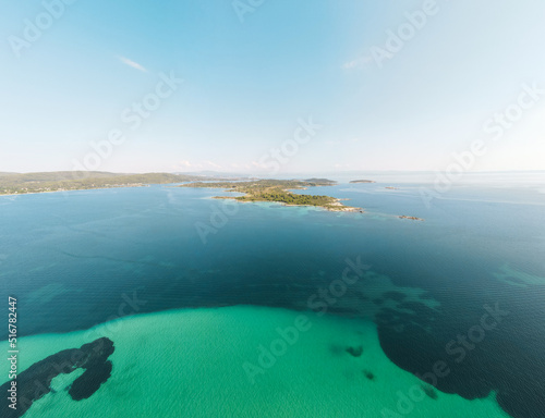 Aerial view of Diaporos Island in Halkidiki, Greece, Small islands with blue lagoon in the Aegean sea during summer holiday season